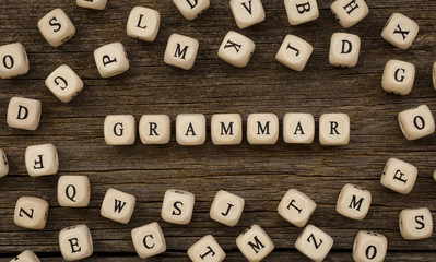 Word GRAMMAR written on wood block