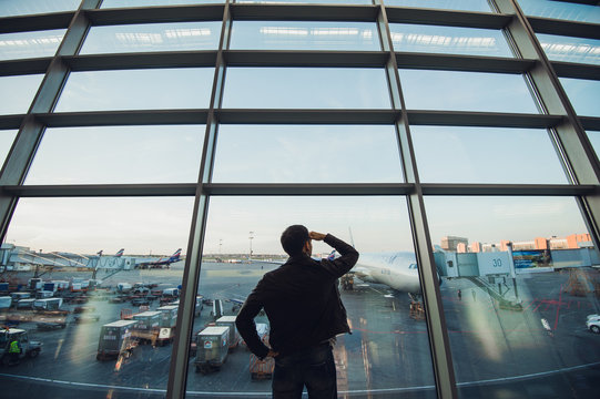 Silhouette of man waiting for the flight