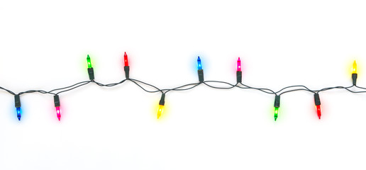 Christmas light bulbs on string in multi colours; blue, yellow, red, pink and green on white...