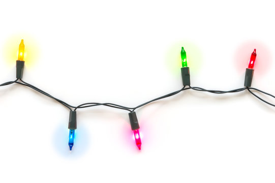 Big Christmas light bulbs on string in multi colours; blue, yellow, red, pink and green on white background for Xmas, new year or special events celebration (holiday ornament concept)