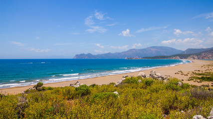 View of the beach from the cliff. Beautiful blue sea. Incredible landscape of the coast. Turkey