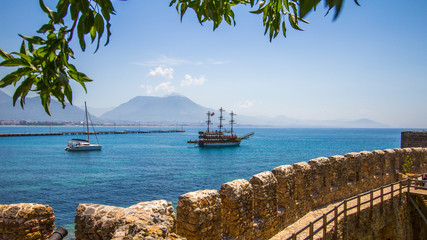 Panoramic view of the ancient ships against the background of the ancient city walls.Turkey