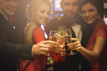 Hands with a full glasses of sparkling wine