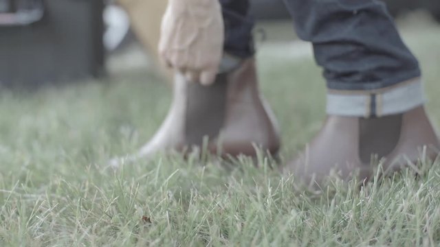 Woman putting boots on 
