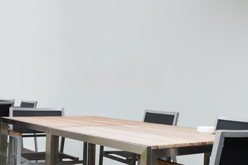 Conference room with place for drawing on wall. Closeup of modern office. White poster on wall.  