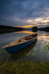 Fototapeta na wymiar Blue kayak at the lake