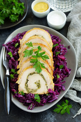 Fried pork loin stuffed with greens and red cabbage.