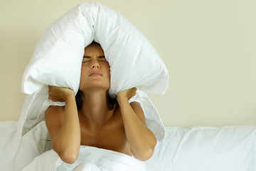 Woman with pillow on her head