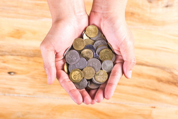 Close up coins in hand