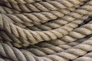 Close-up photo of sailing rope hanging loosely of a spool