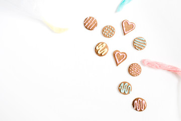 Colorful hand made cookies on white background. Flat lay, top view.
