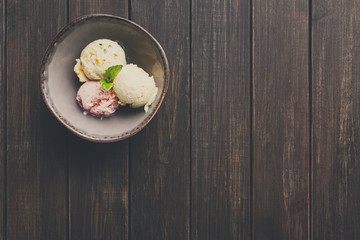 Assorted ice cream scoops in bowl top view
