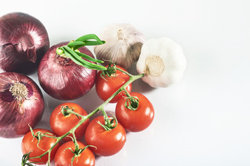 blue onion garlic and tomato isolated on white background