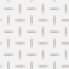 A pattern of paperclips on a white background