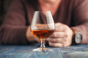 Lonely man drink alcohol on kitchen, alcoholism abuse