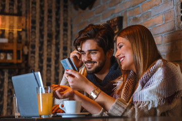 Beautiful young couple in cafe.