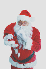 Real Santa Claus carrying big bag full of gifts, isolated on white background