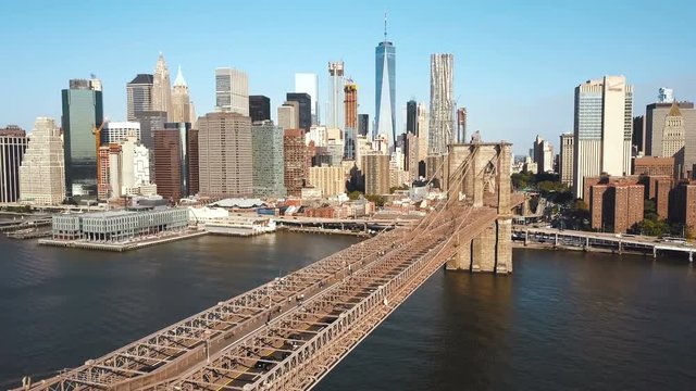 Aerial view of the Brooklyn bridge to Manhattan in New York, America through the East river in sunny day.