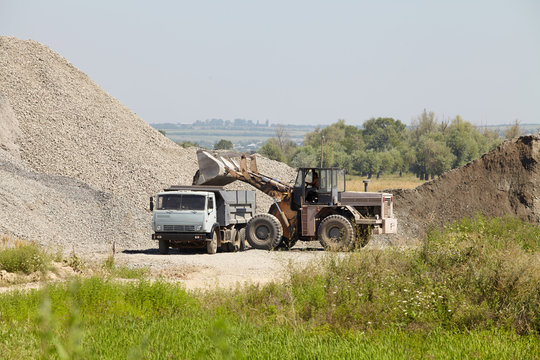 work in an industrial quarry, truck loading