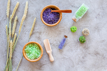 Fototapeta na wymiar bath salt in herbal cosmetic with wheat on stone desk background top view