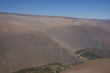 Fototapeta na wymiar Large river canyon of the Rio Camarones running through the Atacama Desert in the Arica y Parinacota Region of northern Chile.
