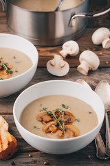 Cream soup puree with mushroom on wooden background