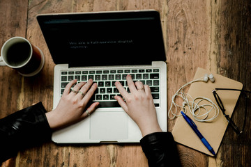 Fototapeta premium Woman typing on laptop