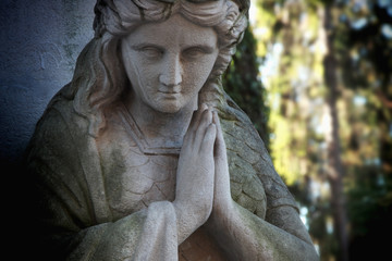Fototapeta na wymiar Antique statue of the Virgin Mary praying (religion, faith, holy, sin)
