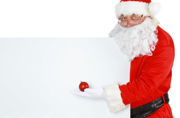Happy Santa Claus looking out from behind the blank sign isolated on white background