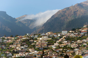 Fototapeta na wymiar houses on the steep slopes of the city of Funchal, capital of the Portuguese island of Madeira