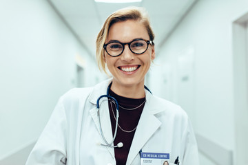 Female doctor standing in hospital corridor