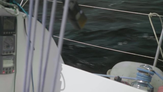 Slow motion view from yacht board of splashing river water astern