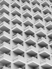 high rise building with residential flats or apartments in a white concrete development with balconies