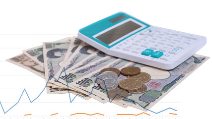 Japanese currency yen bank notes with  Japanese yen coin and calculator with finance chart and graph on white background, finance planning concept