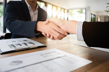 business executives partnership hand shaking