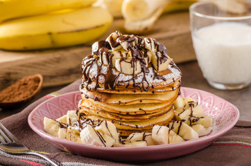 American pancakes with banana, chocolate
