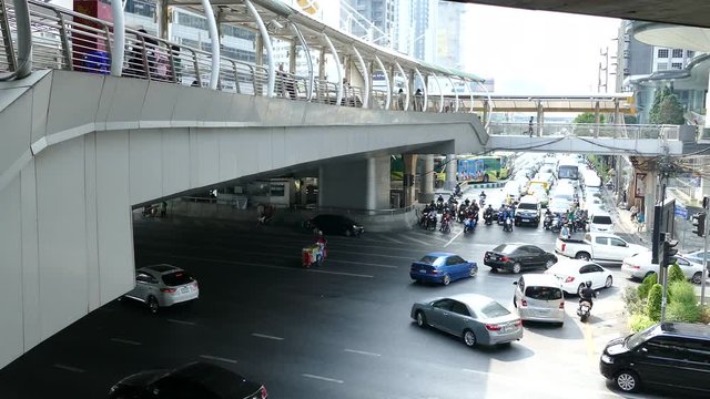 Time lapse from traffic and the skywalk at Sathon District in Bangkok Thailand