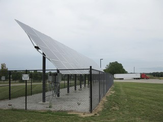 Side view of solar panels on a cloudy day