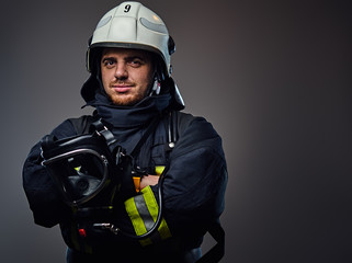 Fototapeta premium Studio portrait of firefighter dressed in uniform.