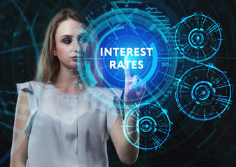 The concept of business, technology, the Internet and the network. A young entrepreneur working on a virtual screen of the future and sees the inscription: Interest rates