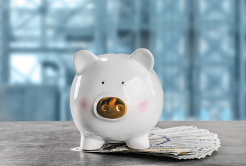 Piggy bank with money on table. Business concept
