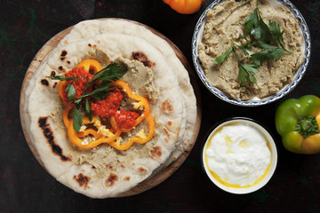 Pita bread with hummus and pepper relish