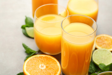 Glasses of fresh orange juice on table, closeup