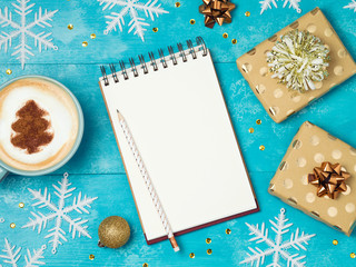 Notebook with gift boxes and coffee cup