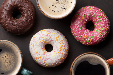 Coffee cups and colorful donuts