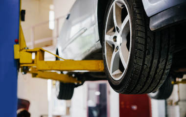 The vehicle is raised for service replacement of parts, oil, and seasonal and yearly maintenance.