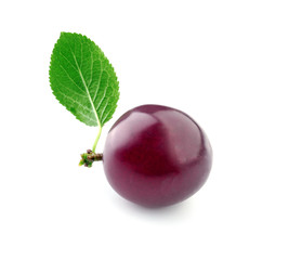 Ripe fresh plum on white background