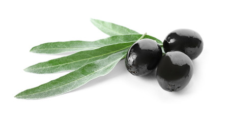Black olives with leaves, isolated on white