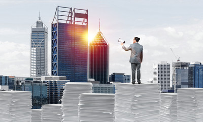 Businessman standing with megaphone.