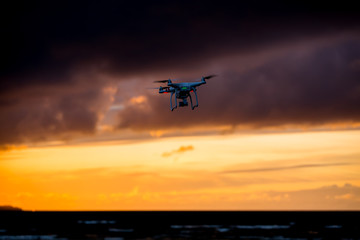 Fototapeta na wymiar Flying drone over sea and cloud sky